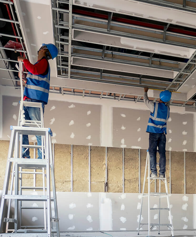 Construction worker installation ceiling